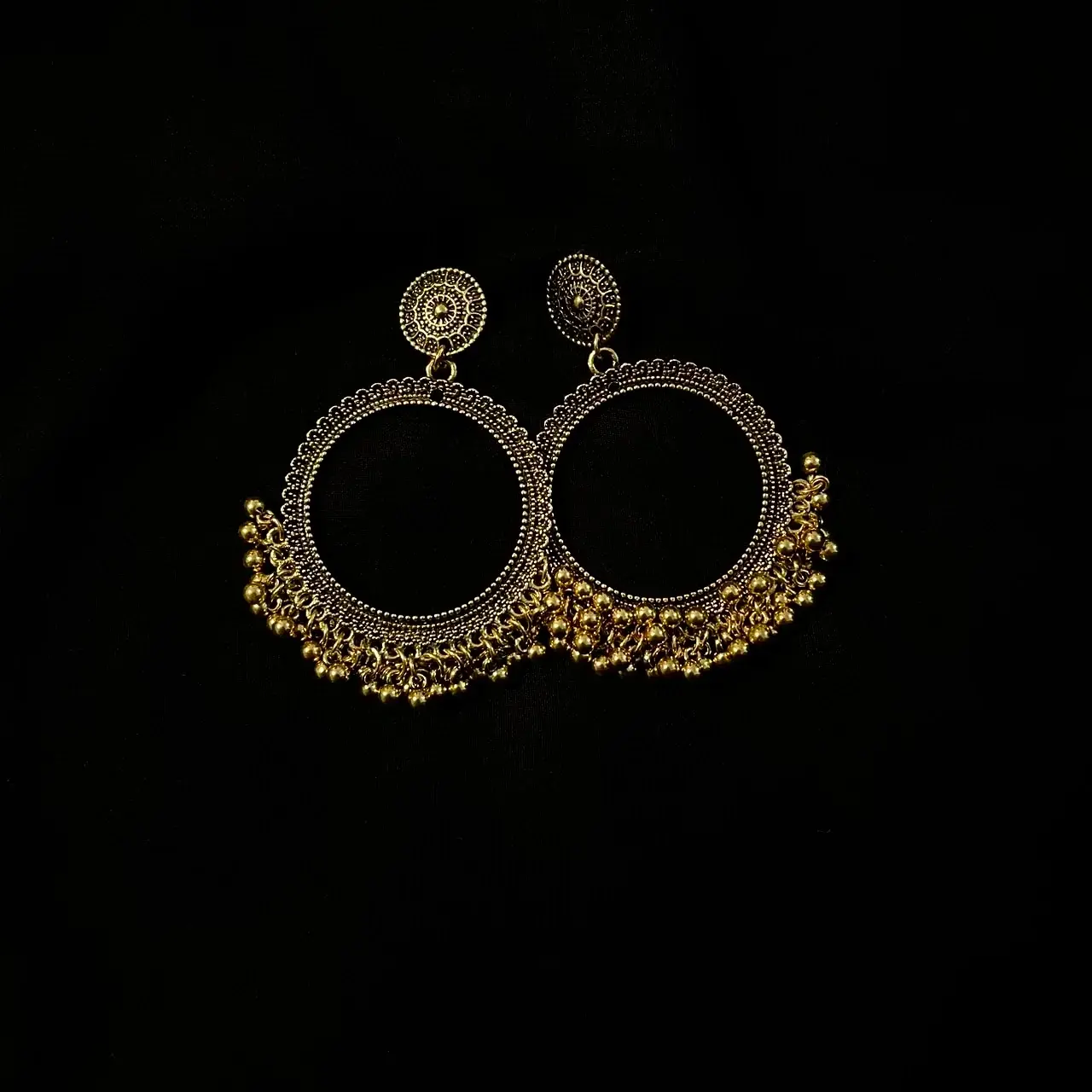 Antique Gold Ghungroo hoop earrings, part of the Kaywee collection