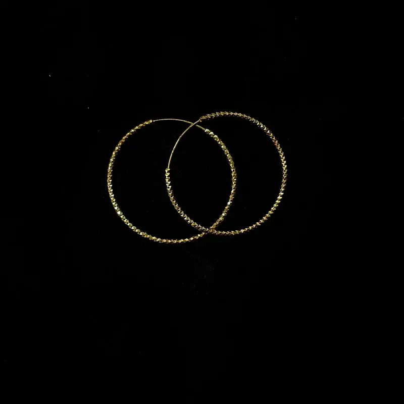 Diamond-cut textured gold hoops, showing the Kaywee finishing detail